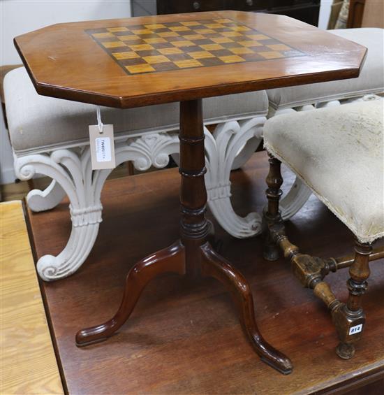 A mahogany games table on tripod base W.60cm.